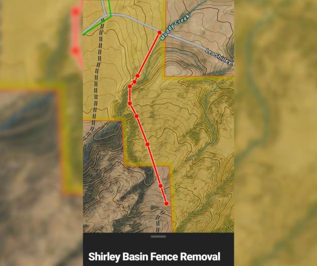 A map shows the one-mile stretch of fence on a map with a red line.