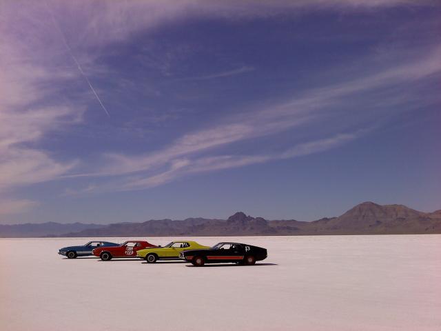 Cars speed across Bonneville Salt Flats
