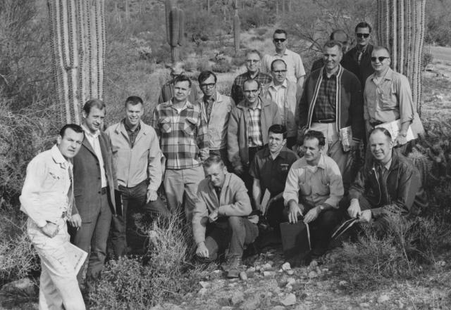 Black and white photo showing the first Lands and Minerals Class attendees in the winter of 1969 outside in the desert posing with cacti.