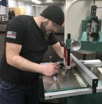 Man working on a band saw