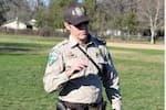 A BLM ranger in an open grassy field