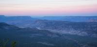 a distant view of buttes and canyons