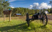 A replica cannon and sign greet visitors to Fort Egbert.