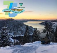 A snowy scene above a lake