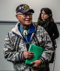 Man holding green folder