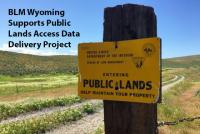 Entering Public Lands sign on a post by a 2-track road. Text: BLM Wyoming supports public lands access data delivery project. 