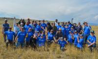 Volunteers pose for a photo wearing blue National Public Lands Day t-shirts