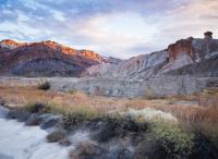 A colorful desert canyon at sunset