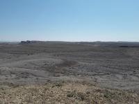 A dry desert landscape with blue skies