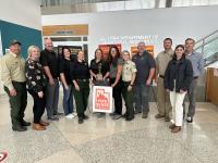 Members of the Fire Sense campaign stand together with the Smokey Bear Award trophy in the middle. Pictured are employees of the BLM, US Forest Service, Utah Department of Natural Resources, and Bonneville Communications.