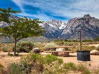 A campground with mountains in the background. 