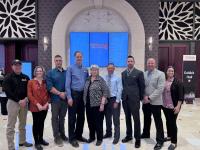 Nick Howell and Shawn Peterson of Color Paria Fuels Team stand with members of the Wildland Fire Mitigation Award Committee.