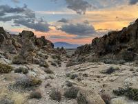 Dark hills amidst a colorful sunset