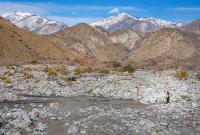 a wash at the base of two mountain ranges.