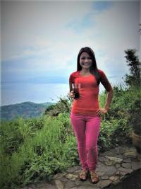 Jenifer Pable drinking Sago Gulaman and posing in front of one of the many active volcanos in Tagaytay. Photo courtesy of Jennifer Pable.