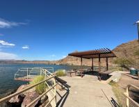 Fishing pier and shade structure for fish cleaning at Take Off Point.