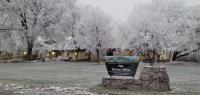 Exterior of Vale District Office building in the winter, with snowy trees