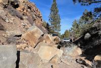 Boulders block a bike trail in the high desert