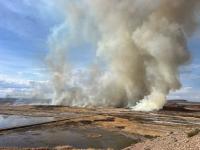 Smoke rises from the Pariette Wetlands following the burn in 2024.