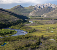 A creek runs through a mountain valley 