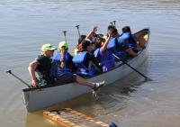 Students and chaperones piled into 10-person canoes with Wilderness Inquiry staff to take a spin around Cochiti Lake.