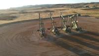 four pumps on an oil field