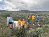BLM WY staff and WY Conservation Corp crew pose for a photo during the restoration project at Muddy Creek in WY.