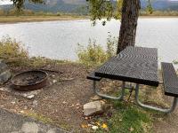Image of lakeside picnic table and fire ring