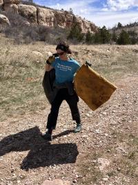 Volunteer helps pick up garbage at Rogers Canyon in WY