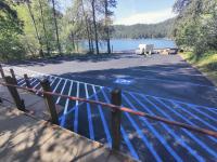 Image of freshly resurfaced asphalt parking area