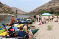 Image of students in rafts along rivershore
