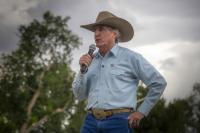Secretary of the Interior Doug Burgum addresses the crowd on a cloudy day