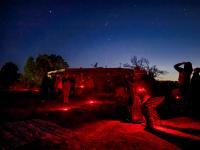 Red lights illuminate stargazers and telescopes at El Malpais National Conservation Area.