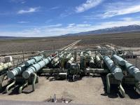 A photo of a geothermal power plant on private property, near BLM managed public lands in Idaho