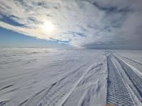 Ice road on snow packed landscape of the National Petroleum reserve in Alaska in winter.