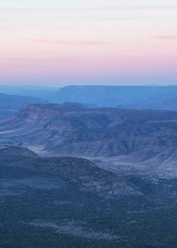 a distant view of buttes and canyons