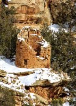 The Painted Hand Pueblo, an Anasazi village inhabited in the 1200s, sits amid the backcountry of Canyons of the Ancients National Monument. The site is named for pictographs of hands painted near its focal point, a large stone tower perched atop a boulder