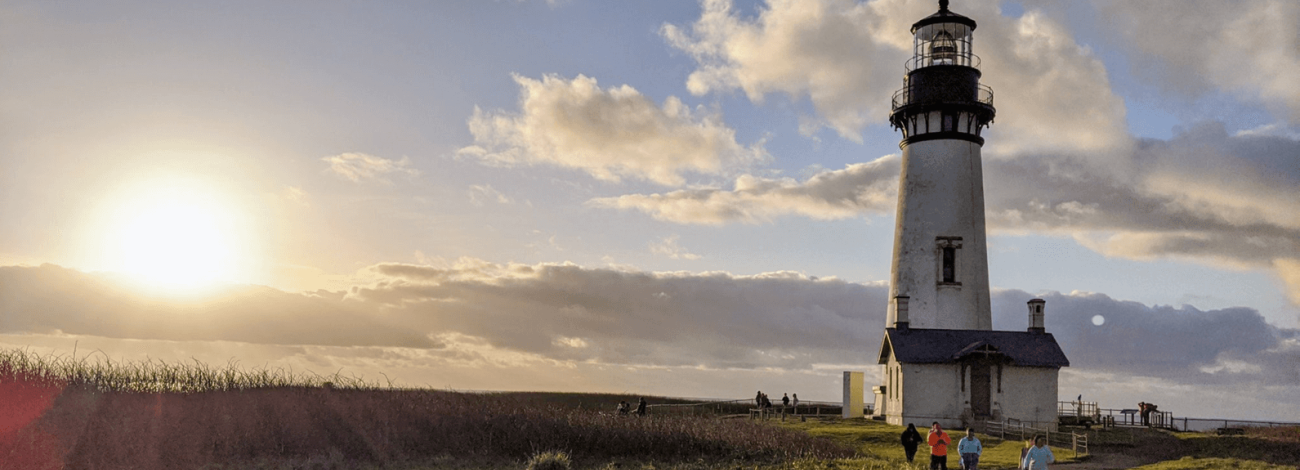 Kids enjoying the sunset at Yaquina Head Lighthouse