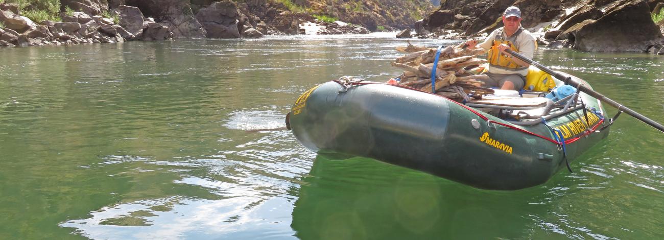 Image of man in a raft on the river