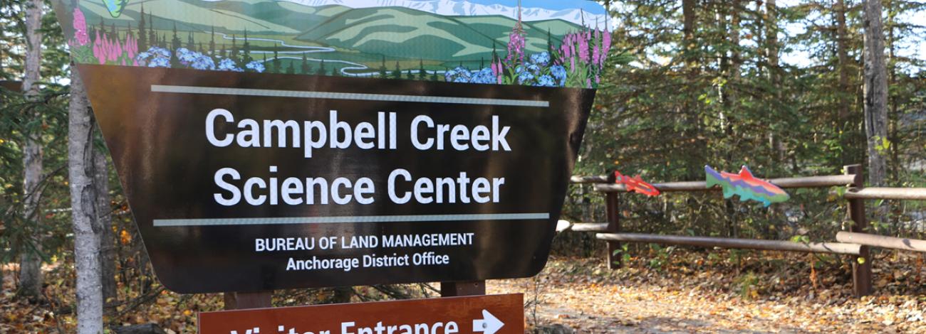 The BLM Campbell Creek Science Center sign at the main path to the front entrance