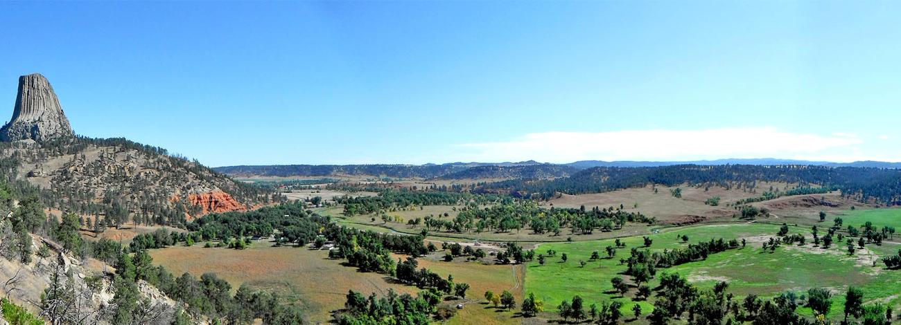 The borders between public land and irrigated private land stand out in this panoramic photo of Devil's Tower National Monument