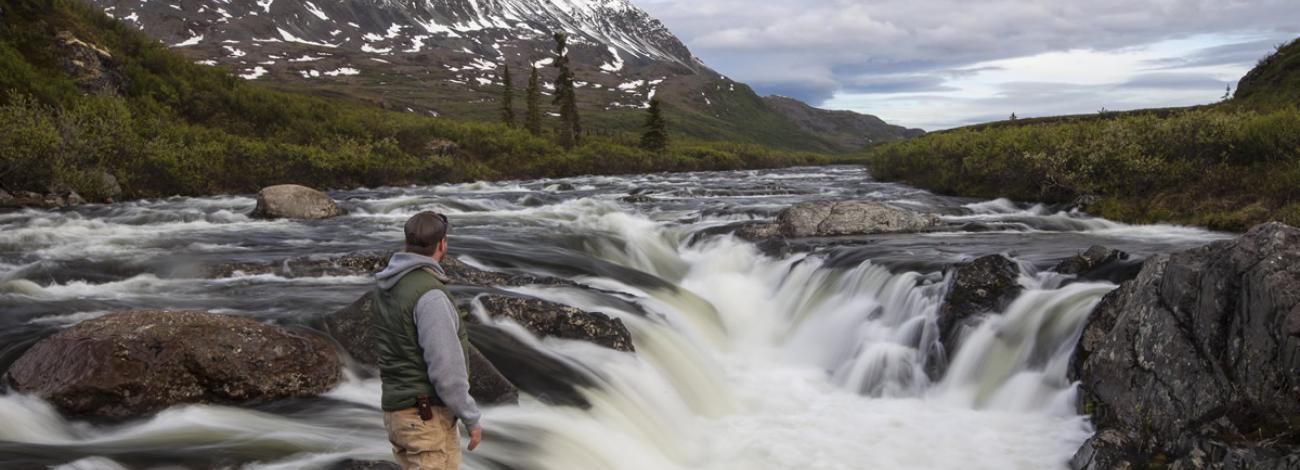 Angler standing at Delta Wild and Scenic River falls