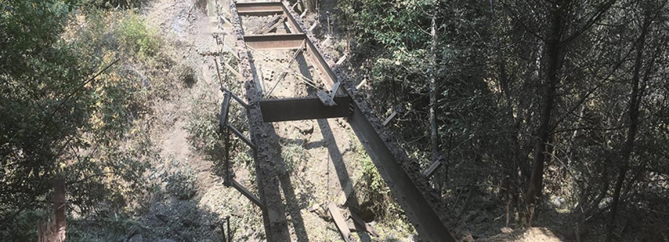 Pictured is a trail bridge that burned during the River Fire