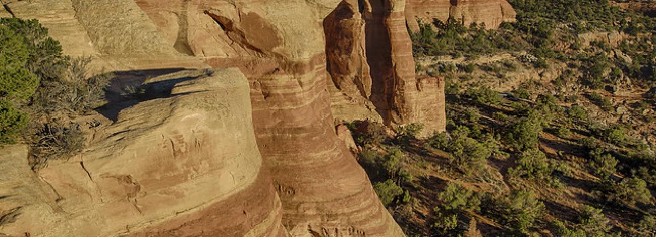 landscape feature of mcinnis canyon with rocks in foreground