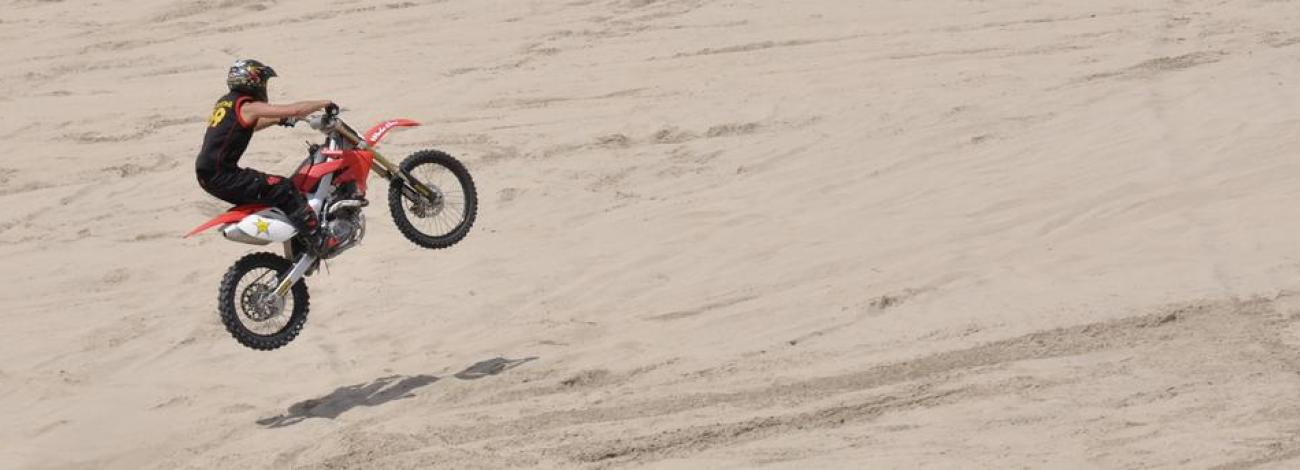 Motorcycle rider at Weiser Dunes