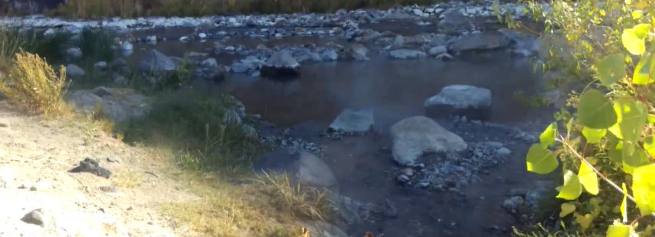 Steam rises from Snively Hot Springs