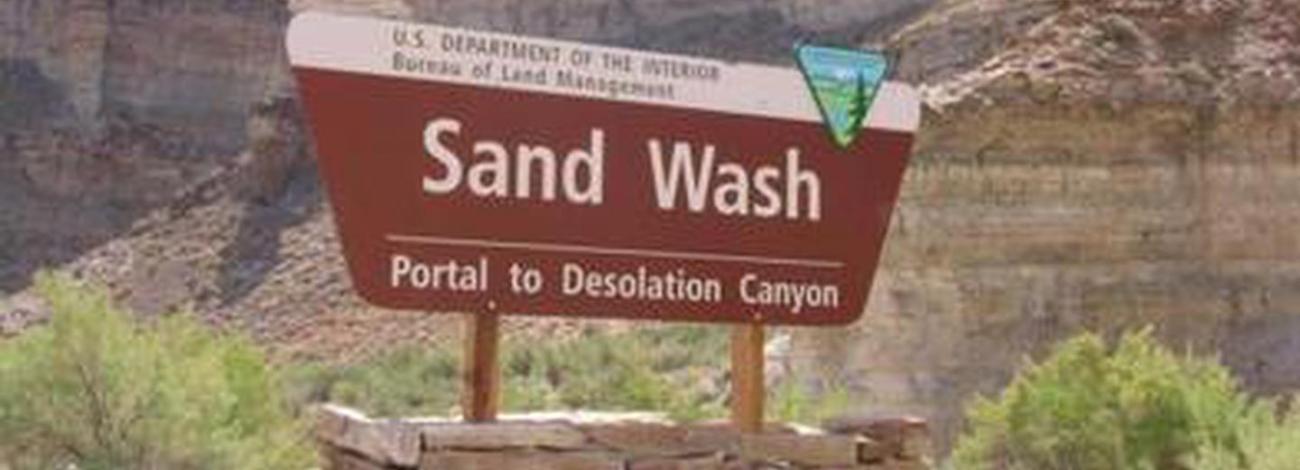 Bureau of Land Management brown portal sign for Sand Wash Portal to Desolation Canyon