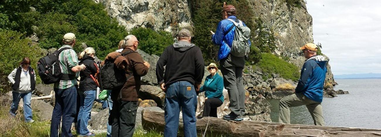 San Juan Islands National Monument members having a discussion near water's edge