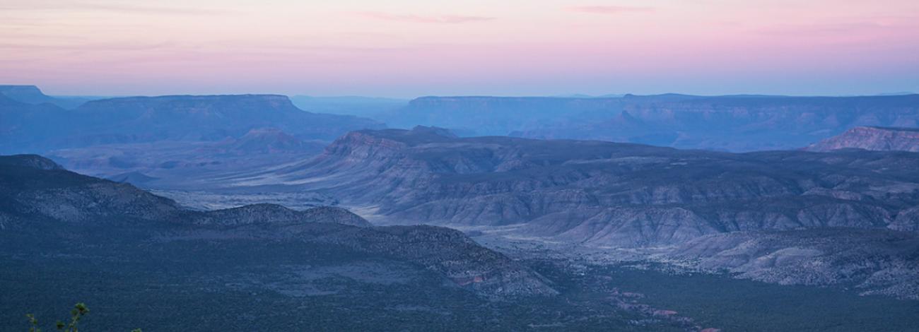 a distant view of buttes and canyons