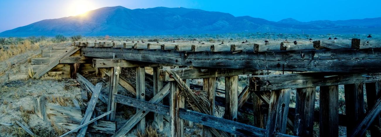 Transcontinental Railroad passing through Utah under sunset